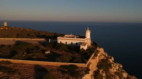 White lighthouse in front of the sea Stock Footage 130957642