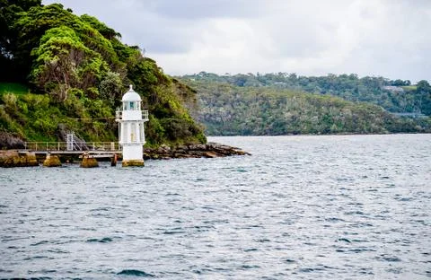 White lighthouse in the sea1 Stock Photos