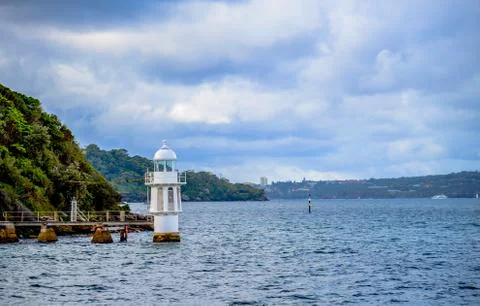 White lighthouse in the sea2 Stock Photos