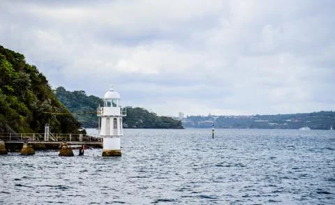 White lighthouse in the sea3 Stock Photos