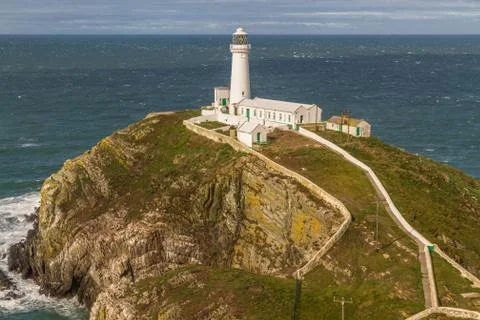 White lighthouse at South Stack. Stock Photos