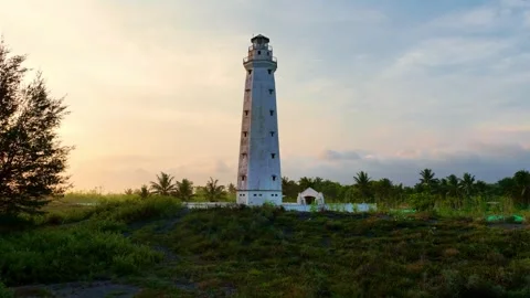 White lighthouse standing in soft evening light Stock-Footage 335439862