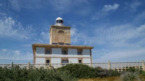 The white lighthouse of Tabarca in sunshine and blue skies. Stock Footage 152856427