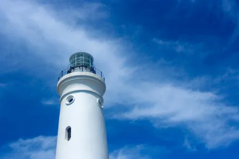 White Lighthouse Tower With Cloudy Blue Sky Stock Photos