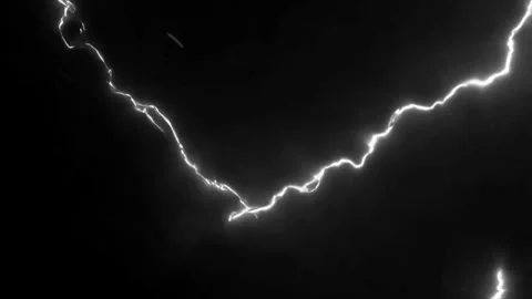 White Lightning Branches Expanding Across Dark Background with Intense Electric Stock Footage 335980910