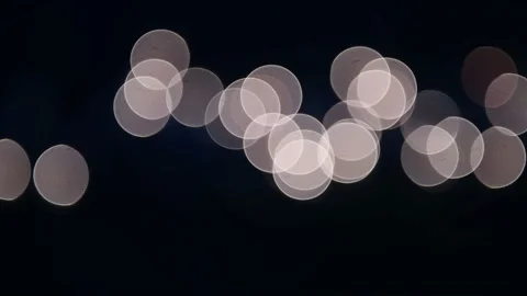 White lights bokeh blurred circles abstract background on black Stock Footage 163850352