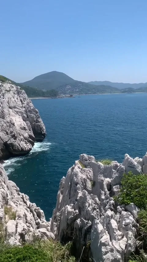 White Limestone Cliffs Overlooking Blue Ocean Stock Footage 340868630
