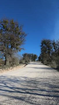 White limestone road under blue sky Stock Photos