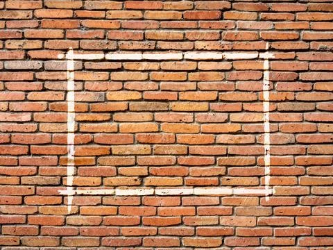 White line graffiti as a horizontal rectangle frame on old grunge red brick.. Stock Photos