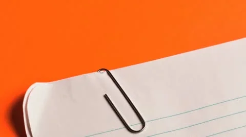 White lined note paper against orange background Stock Footage 21303227