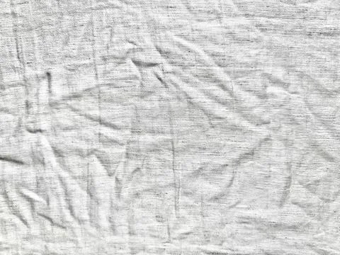 White linen fabric background featuring minimalist wrinkled texture and organ Stock-Fotos