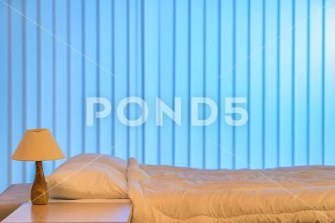 The white linens on the bed. Evening night time Stock Photos