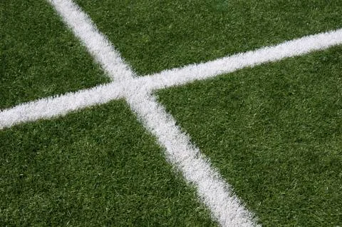 White lines intersecting on grass Stock Photos