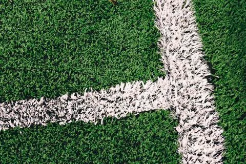White lines painted on artificial grass on a soccer field Stock Photos