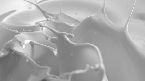 White Liquid or Milk Fluid Splashing in Slow Motion Video stock 119370914
