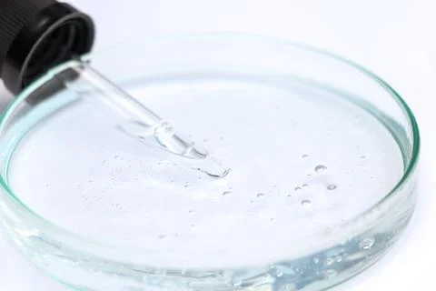 White liquid or raw material for skin care product Stock Photos