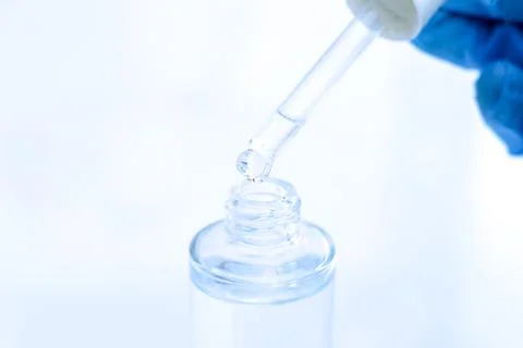 White liquid or raw material for skin care product Stockfoto's