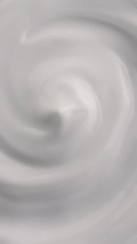 White liquid vortex swirls into an abstract monochrome spiral texture Stock Footage 345024994