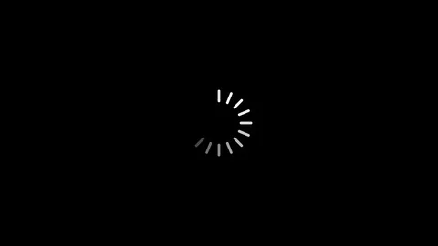 A white loading wheel icon slowly scrolls against black background as Stock Footage 111457640