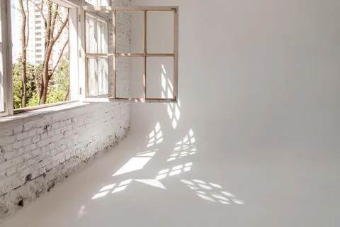 A white loft with a large open window. photographic studio. Stock Photos