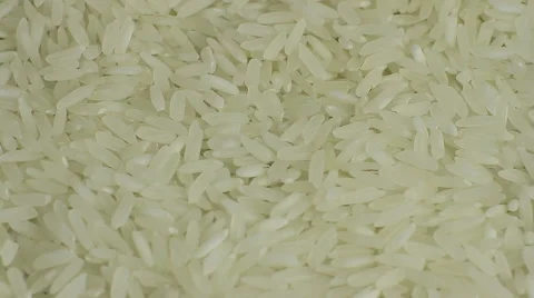 White long rice background, uncooked raw cereals, macro closeup rotation Video stock 53789286