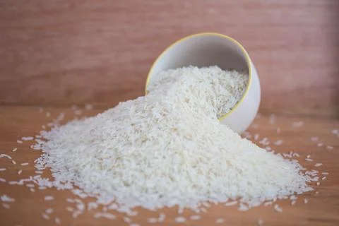 White long rice background, uncooked raw cereals, macro closeup Stock Photos