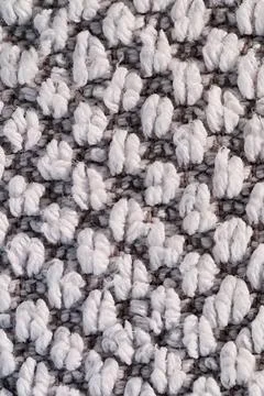 White loop pile textile texture on gray woven fabric with soft macro detail Foto stock