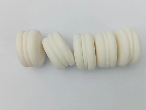 White macarons on clean white background Stock Photos