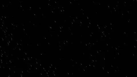 White Magic Sparkle Trails Falling on Black Background Stock Footage 331547259