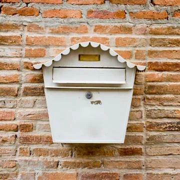 White Mail Box in Front of wall Stock Photos