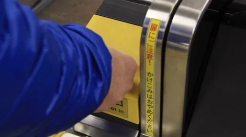 White Male inserting ticket into ticket machine barrier Video stock 58961112