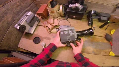 White Male Maintains Retro 1930’s 16mm Movie Film Camera In Rustic Wood Workshop Vidéo 139181455