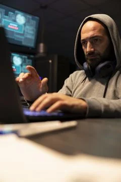 White Male Programmer Typing Secure Code at Night 写真素材
