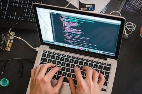 White male programming on his MacBook Stock Photos