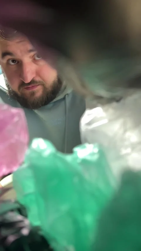 White man with beard takes out empty black bag out of focus from closet Stock Footage 298661152