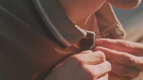 White Man Buttoning Collar With Careful Fingers, Preparing For Meeting In Warm Stock Footage 327154539