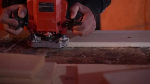 White man cuts a bar with a circular saw in the workshop Close up Video stock 120740396