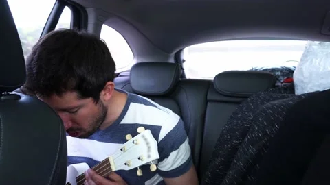 A white man giving singing lessons with his cell phone by video call with a Stock Footage 172267461