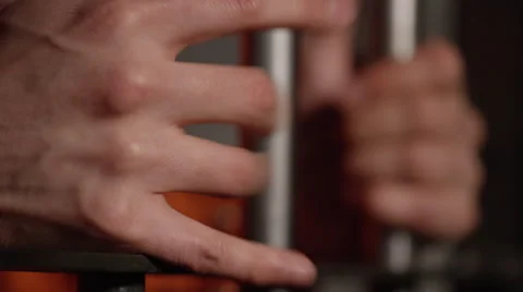 White man hands shaking bars of prison cell in slow motion Stock-Footage 62707432