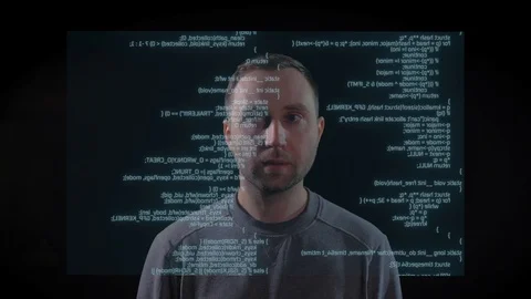 White man is looking at the code, text, script on the screen in front of him. Stock Footage 106301637