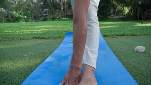 White man performing yoga posture in nature. Close Up. 스톡 동영상 168369579