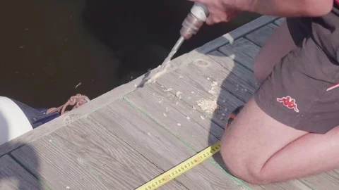 White man repairs pontoon Video stock 77651214