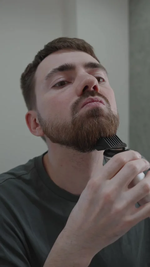 White man shaping lower beard with trimmer model prep Stock-Footage 333332078