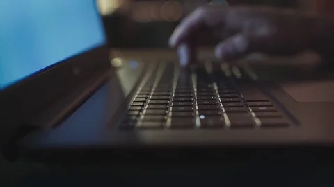 White Man Typing in Laptop Keyboard at Night 動画素材 83138415