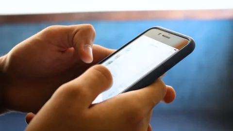 White Man Using WhatsApp on his Phone and Typing quickly with his hands Stock Footage 98255006