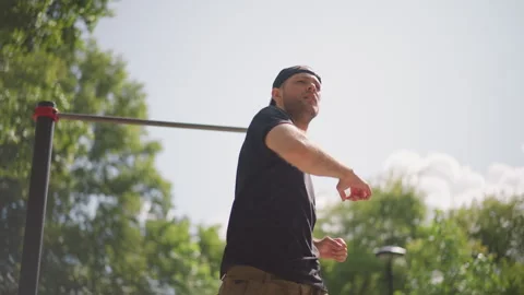 White Man Warming Up For Pullups Under Blue Sky, Stretching Arms And Testing Stock Footage 324753978