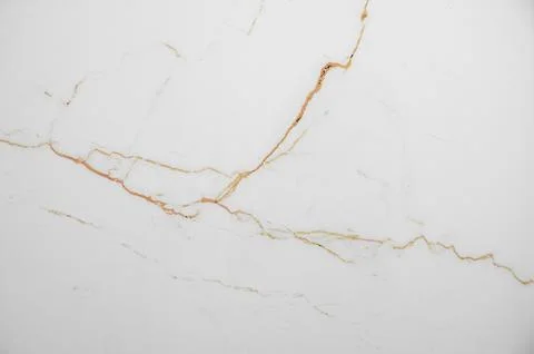 A white marble background with subtle brown veining and a natural stone tex.. 写真素材