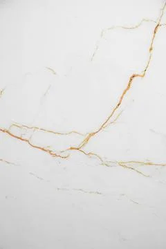 A white marble background with subtle brown veining and a natural stone tex.. Stock Photos