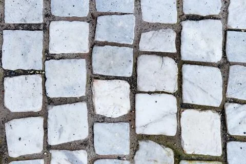 White marble cobblestone pavement texture top view for background Stock Photos