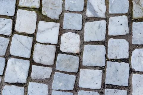 White marble cobblestone pavement texture top view for background Stock Photos